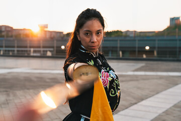 Chinese young woman practicing wushu kung fu.