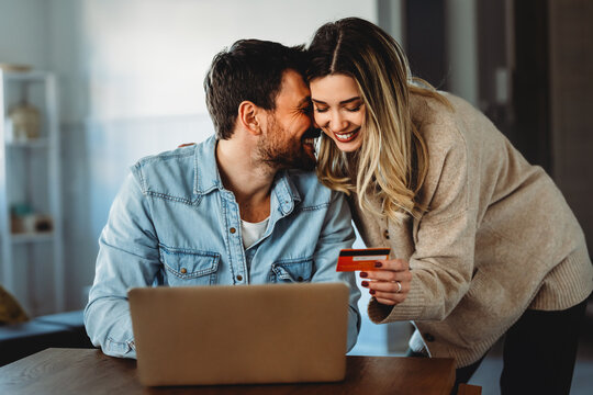 Multicultural couple working remotely, planning finances and investments online. Digital lifestyle - Powered by Adobe