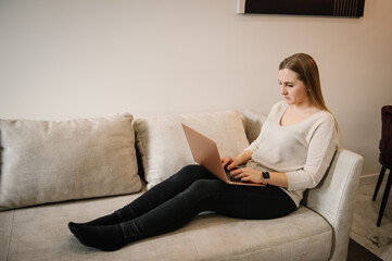 Analyst woman looking at laptop monitor feeling tired frustrated reading bad news on financial market working in home. Investor broker analyzing indices. Young busy stressed business trader.