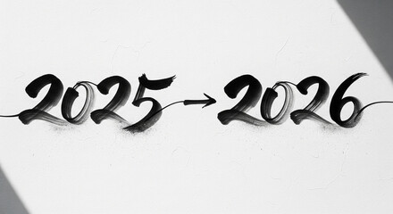 Black calligraphy brush stroke writing 2025 to 2026 transition arrow on textured white background with dramatic light