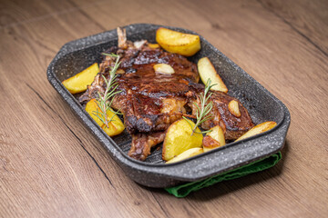 Beef steak on the bone with baked potatoes