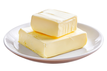 Two blocks of yellow butter on a white plate ready for cooking or baking isolated on transparent background