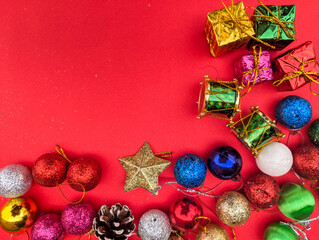 christmas balls stars gifts box decorations over red background