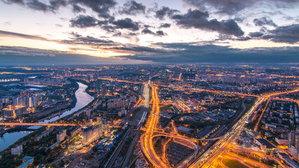 Fototapeta premium Aerial top view of Moscow city day to night timelapse after sunset. From the observation deck