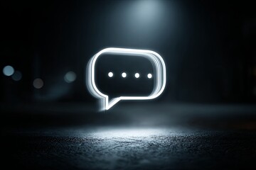 A clean, dramatic, moody shot of a single, illuminated speech bubble icon (focused object) floating digitally over a dark, blurred background, dialogue, message, cinemati