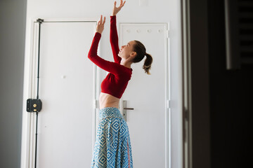 Elegant woman prepares confidently with steady focus indoors