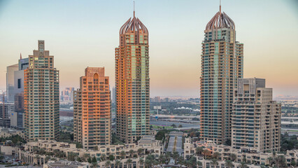 Obraz premium Dubai Marina skyscrapers aerial timelapse, port with luxury yachts and marina promenade