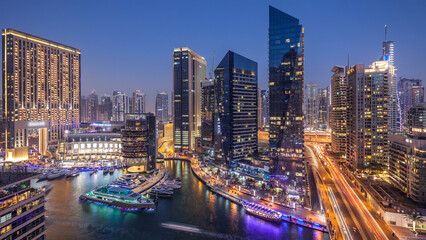 Beautiful aerial top view day to night transition timelapse of Dubai Marina canal