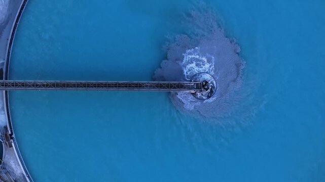 Aerial view of a straight bridge contrasting with the swirling water, creating a captivating visual of nature and engineering, Tucson, Arizona, United States.