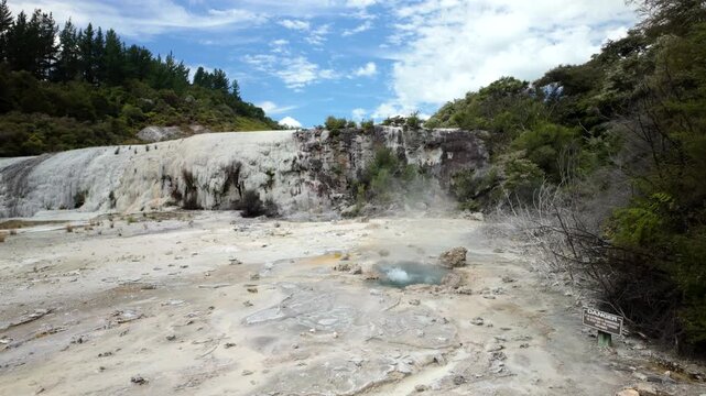 Steaming white geothermal cliff in New Zealand