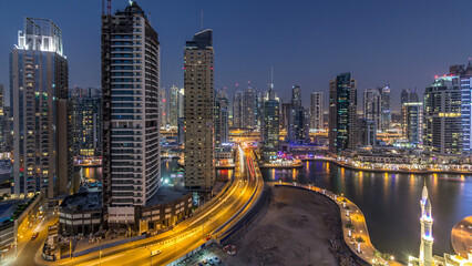 Beautiful aerial top view day to night transition timelapse of Dubai Marina canal