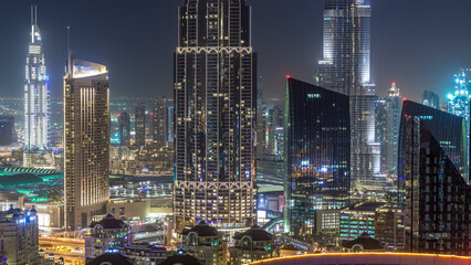 Dubai downtown skyline day to night timelapse with tallest building and Sheikh Zayed road traffic, UAE