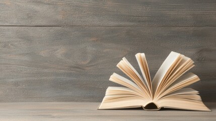 An open book with a wooden background.