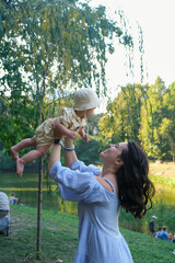 Mother and Baby Enjoying a Sunny Day in the Park Portrait