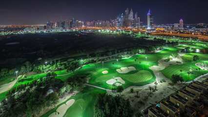 Dubai Marina skyscrapers and golf course day to night timelapse, Dubai, United Arab Emirates