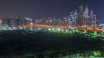 Dubai Marina skyscrapers and golf course day to night timelapse, Dubai, United Arab Emirates