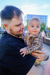 Father and Baby Smiling Outdoors Portrait