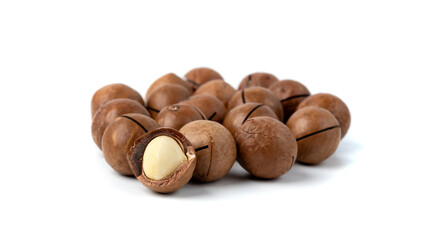 Macadamia nuts isolated. Natural raw peeled macadamia seeds and shells