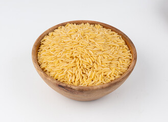 Raw orzo pasta, risoni or kritharaki pile