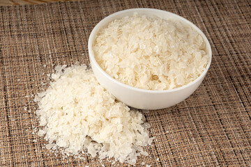 Raw flattened rice. Dry rice flakes or poha, Indian breakfast food