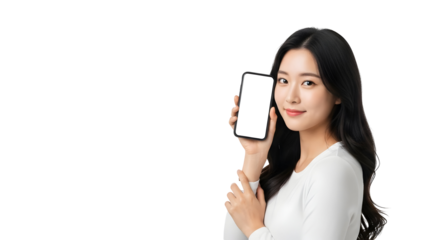 Attractive young Asian woman confidently displays a modern smartphone featuring a pristine white screen perfect for showcasing new applications or digital content designs
