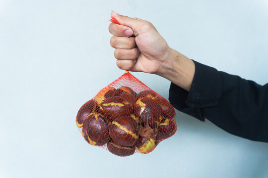 Jengkol or jering (Archidendron pauciflorum). Also known as blackbead, dogfruit, djenkol. White background. Food. Fresh smell.