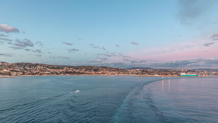 Aerial view of sea with waves and port from ship sailing in the open sea timelapse