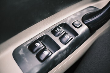 Fototapeta premium Set of close-up shots of a car interior featuring climate control buttons, dashboard switches, air vents, and electric window controls. Detailed automotive components showcasing design, 