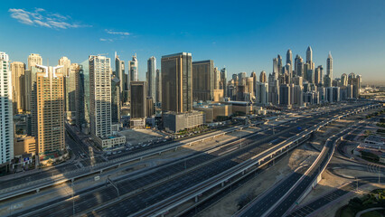 Dubai Marina skyscrapers aerial top view at sunrise from JLT in Dubai timelapse, UAE.