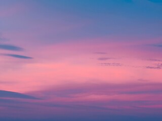 A serene twilight sky with a soft gradient from deep blue to pastel.