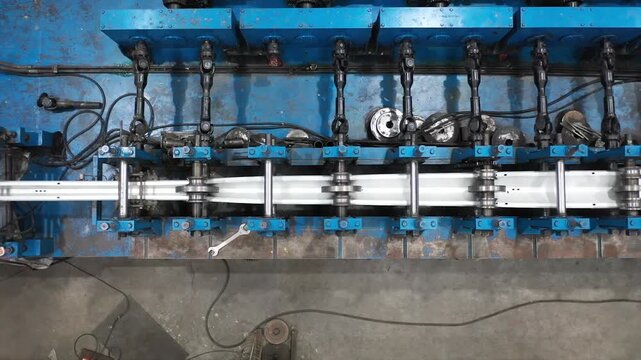 Morbi, Gujarat, India 12 09 2025: A drone view of metal sheets are bending in machine.
