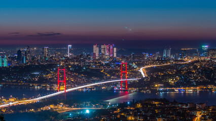Obraz premium Istanbul city skyline cityscape time lapse from day to night view of bosphorus bridge and financial business center