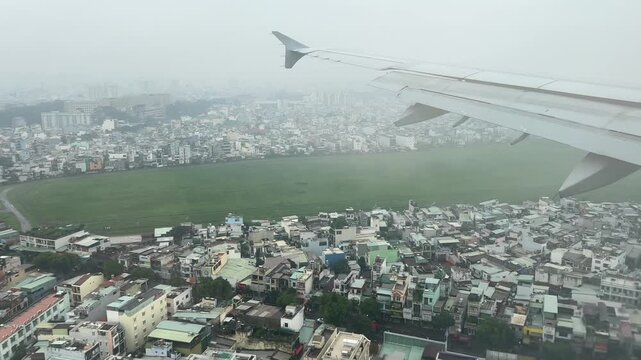 View from aircraft window arriving at Ho Chi Minh City airport on a storming morning 