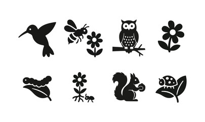 Fototapeta premium A vector illustration set of black animal silhouettes featuring cat, dog, bird, and owl icons for design collections