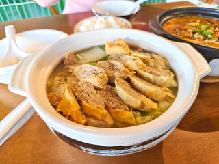 Close-up Yunnan hotpots in a white bowl. Delicious Chinese food.