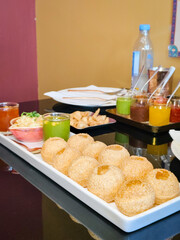 Close-up pani puri dish in an Indian restaurant. Delicious Indian street food.