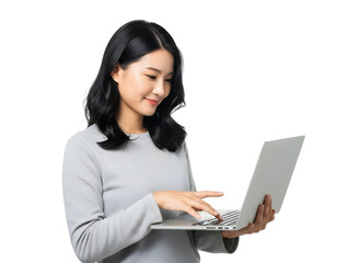 Young Asian woman professionally engaged with her laptop, demonstrating efficient online communication and digital productivity for modern remote work and technology applications