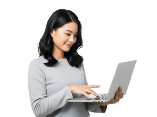 Young Asian woman professionally engaged with her laptop, demonstrating efficient online communication and digital productivity for modern remote work and technology applications