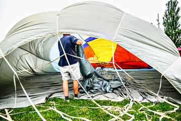 Preparing a hot air balloon to start the flight, heated by hot air