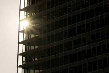 Modern geometric architecture facade showing abstract building pattern with symmetry, reflection and minimalism across clean structural lines
