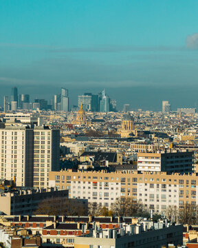 Aerial view of the golden dome of Les Invalides and the modern skyline piercing the horizon, a tapestry of architectural eras, Paris, Ile-de-France, France.