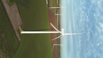 Aerial view of wind turbines standing tall against the agricultural fields, a blend of modern innovation and rural landscape, Spalding, England, United Kingdom.