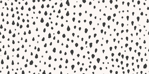 Seamless pattern with abstract black ink spots in brush stroke style, black and white colors, used for animal skin texture or modern textile design, vector illustration.