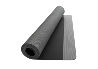 partially unrolled charcoal grey ribbed yoga mat revealing matte black interior, elegantly presented on a seamless bright white studio background with ample copy space. concept of high-quality