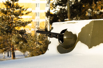 Machine Gun Port on a Snow-Covered Armored Vehicle Turret