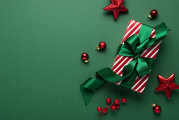 Merry Christmas and Happy Holidays greeting card, frame, border. New Year. Red Christmas ornaments and gifts, presents on green background top view. Xmas holiday festive theme. Christmas decoration