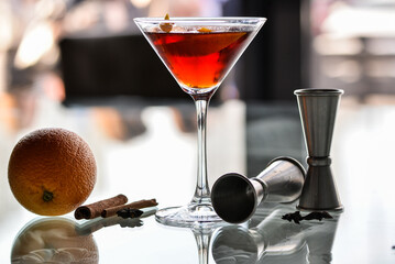 alcoholic cocktail sour in a martini glass on a glass table