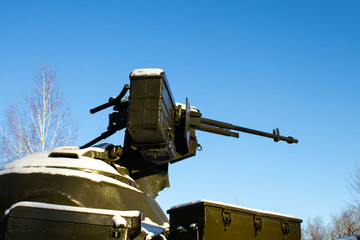 Snow-Covered Anti-Aircraft Artillery Gun on a Military Vehicle