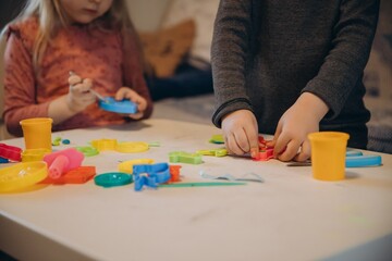 Fototapeta premium Children playing creative games with colorful play dough