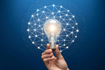 A hand holding a glowing light bulb encompassed by a network of interconnected nodes and lines representing innovation